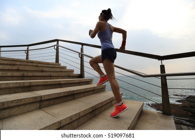 healthy lifestyle young fitness sports woman  trail runner running on seaside - Shutterstock ID 519097681