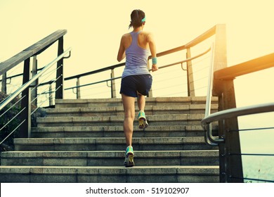 healthy lifestyle young fitness sports woman running up on stone stairs seaside - Powered by Shutterstock