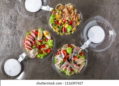 Healthy Light Vegetarian Salad Or Hearty With Meat In Plastic Package For Take Away Or Food Delivery.  Outdoor Food In Plastic Containers. Solution Of Balanced Nutrition.