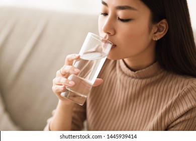 Healthy Liquid. Asian Girl Drinking Clean Water From Glass, Free Space