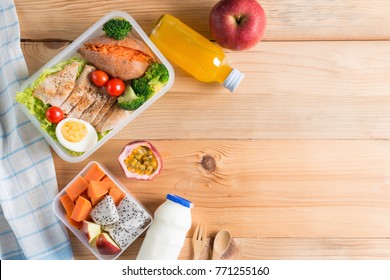 Healthy Lunch Box In Plastic Package, Grilled Chicken Breast With Sweet Potato, Egg And Vegetable Salad, Fruit, Orange Juice, Milk. Diet Food Concept. Top View And Copy Space.