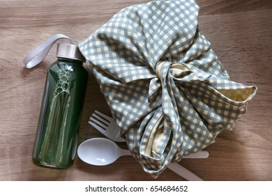 Healthy Lunch Box Wrapped  By Japanese Wrapping Cloth Furoshiki Style With Green Vegetables And Fruits Juice Bottle , Homemade  Healthy  Lunch Box Set For Diet And Health Care Concept