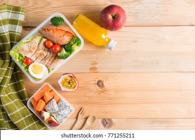 Healthy Lunch Boxes In Plastic Package, Grilled Chicken Breast With Sweet Potato, Egg And Vegetable Salad, Fruit, Orange Juice. Diet Food Concept. Top View And Copy Space.