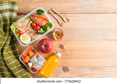 Healthy Lunch Boxes In Plastic Package, Grilled Chicken Breast With Sweet Potato, Egg And Vegetable Salad, Fruit, Orange Juice. Diet Food Concept. Top View And Copy Space.