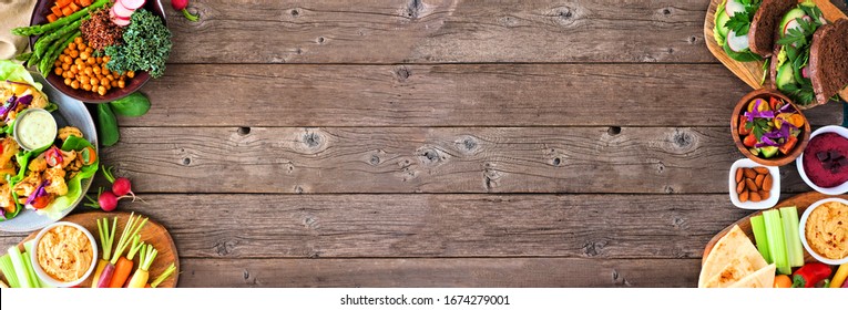 Healthy Lunch Food Double Side Border. Table Scene With Nutritious Lunch Bowl, Lettuce Wraps, Sandwiches, Salad And Vegetables. Overhead View Over A Rustic Wood Background. Copy Space.