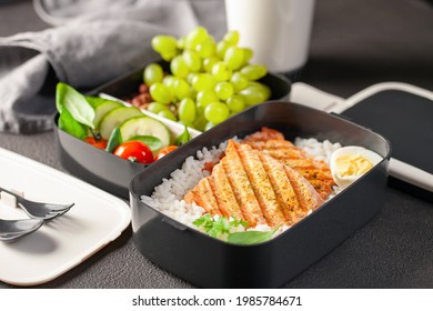 Healthy Lunch At Office Workplace. Takeaway Lunch Boxes With Nutrition Food - Fish, Vegetables And Fruits At Working Desk