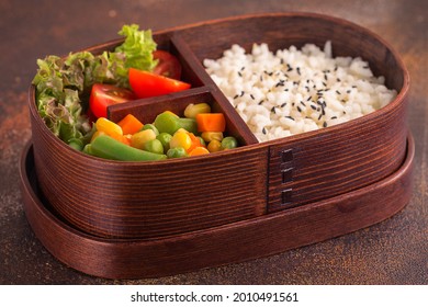 Healthy Lunch In Wooden Japanese Bento Box. Balanced Healthy Food Concept