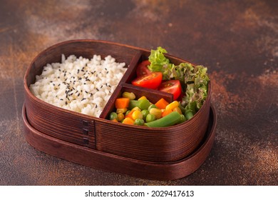 Healthy Lunch In Wooden Japanese Bento Box. Balanced Healthy Food Concept