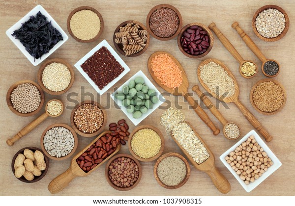 Healthy macrobiotic diet food with a selection\
of legumes, grains, seaweed, cereals, whole wheat pasta, seeds,\
wasabi and monkey nuts on hemp paper. Foods high in fibre,\
antioxidants and\
vitamins.