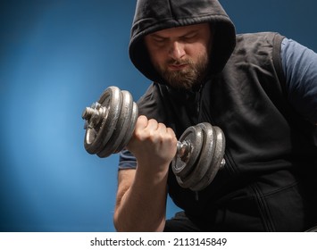 Healthy Man Hard Workout Of Biceps In Gym