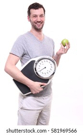 Healthy man with a scale