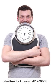 Healthy man with a scale