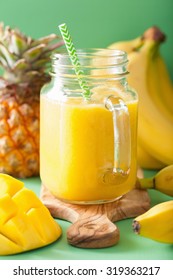 Healthy Mango Pineapple Smoothie In Mason Jars