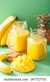 Healthy Mango Pineapple Smoothie In Mason Jars