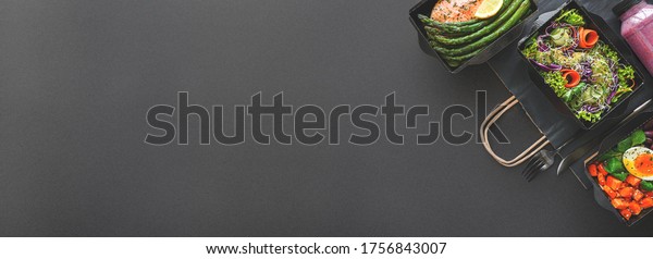 Healthy meal diet plan daily ready menu black\
background, fresh dishes in paper boxes, smoothie, fork knife on\
paper eco bag as food delivery service at home in office, flat lay,\
website photo banner.