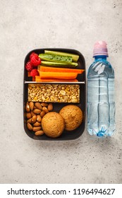 Healthy Meal Prep Containers With Cereal Bar, Fruits, Vegetables And Snacks. Takeaway Food On White Background, Copy Space, Top View.