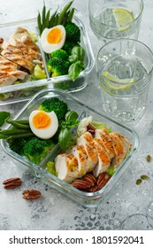 Healthy Meal Prep Containers With Green Beans, Chicken Breast And Broccoli. A Set Of Food For Keto Diet In Lunchbox On A Light Concrete Background. Top View.