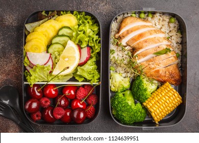 Healthy Meal Prep Containers With Grilled Chicken With Fruits, Berries, Rice And Vegetables. Takeaway Food Jn Dark Background, Top View