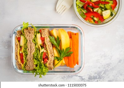 Healthy Meal Prep Glass Containers With Cheese Vegetables Sandwiches And Vegetable Salad Overhead Shot With Copy Space