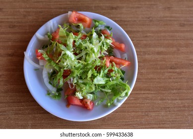 Healthy Mediterranean Salad With Tomato, Lettuce And Onion