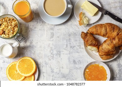 Healthy morning breakfast  served  with  granola, coffee,  fruit juice, milk and bagels, on white concrete background, flat lay, copy space. - Shutterstock ID 1048782377