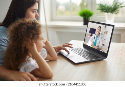 Healthy mother and child enjoying digital era, having online telemedicine consultation with remote doctor or watching educational video by professional paediatrician about cold and flu virus treatment - Shutterstock ID 2104411850