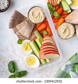 Healthy And Nutricious Lunch Or Snack Boxes To Go With Hummus And Pita, Eggs And Vegetables