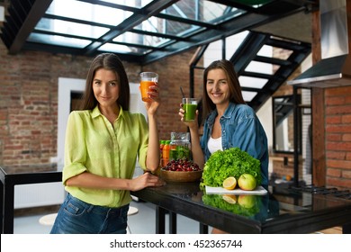 Healthy Nutrition. Beautiful Happy Women Drinking Fresh Juice, Vegetable Detox Smoothie Indoors. Fit Girls Enjoying Weight Loss Drinks Together At Home. Diet And Fitness Food Concept - Powered by Shutterstock