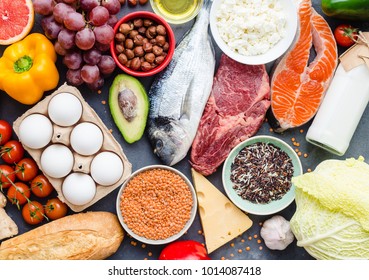 Healthy Nutrition Concept. Balanced Healthy Diet Food. Meat, Fish, Vegetables, Fruit, Beans, Dairy Products. Top View. Cooking Raw Ingredients. Organic Food. Clear Eating. Healthy Food Idea. Overhead
