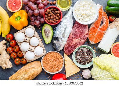 Healthy nutrition concept. Balanced healthy diet food. Meat, fish, vegetables, fruit, beans, dairy products. Top view. Cooking raw ingredients. Organic food. Clear eating. Healthy food idea. Overhead