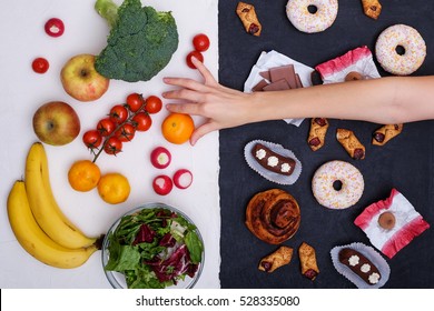 Healthy nutrition concept. Fruits and vegetables vs sweets and unhealthy food.
