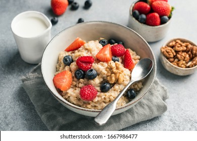Healthy Oatmeal Porridge With Summer Berries Blueberry Raspberry Strawberry In A Bowl. Clean Eating Concept - Shutterstock ID 1667986477