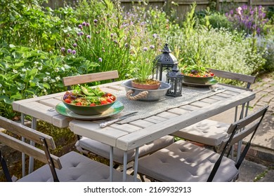 Healthy Pasty And Salad Meals On A Garden Table