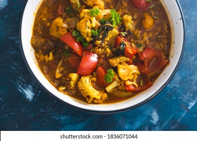 Healthy Plant-based Food Recipes Concept, Vegan Cauliflower And Capsicum Curry Dish With Indian Spices