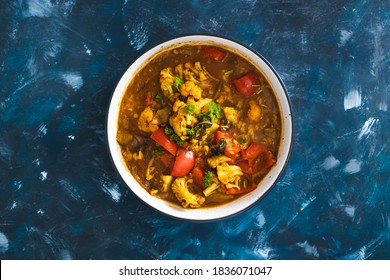 Healthy Plant-based Food Recipes Concept, Vegan Cauliflower And Capsicum Curry Dish With Indian Spices