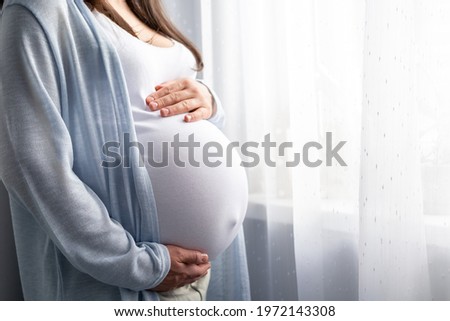 Similar – Image, Stock Photo Pregnant woman holding her tummy