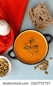 Healthy pumpkin cream soup with vegetables and pumpkin seeds - Shutterstock ID 2267737727
