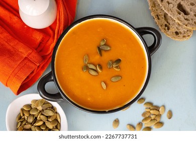 Healthy pumpkin cream soup with vegetables and pumpkin seeds - Shutterstock ID 2267737731