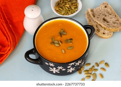 Healthy pumpkin cream soup with vegetables and pumpkin seeds - Shutterstock ID 2267737733