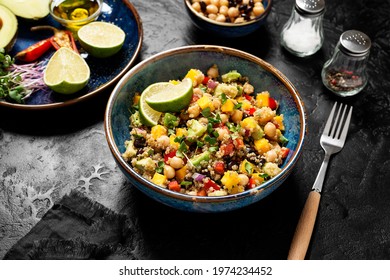 Healthy Quinoa Black Bean Salad With Mango And Avocado. Perfect For Spring, Summer, Fall Or Winter. Black Stone Background.