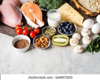 Healthy raw clean ingredients - fruits, vegetables, dairy products, eggs, legumes, dietary meat and fish, nuts and seeds on the table. Copy space. Balanced healthy food concept - Shutterstock ID 1644071833