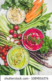 Healthy Raw Summer Vegan Snack Plate. Flat-lay Of Chickpea, Beetroot, Spinach Hummus Dips With Fresh Vegetables And Greens On White Background, Top View. Clean Eating, Dieting, Vegetarian Party Food