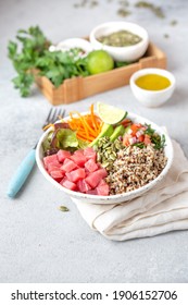 Healthy raw tuna bowl with quinoa and vegetales. Buddha bowl.