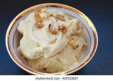 Healthy raw vegan banana ice-cream with walnut topping - Shutterstock ID 429310837