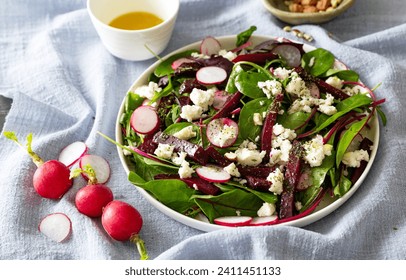healthy salad with  beetroot, feta cheese,  arugula, radish
