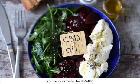 Healthy Salad With Beetroot And White Cheese. Salad With Cannabis Oil. CBD Food Concept.