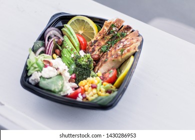 Healthy Salad With Chicken Breast And Vegetables In Black Plastic Box