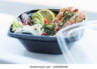 Healthy Salad With Chicken Breast And Vegetables In Black Plastic Box