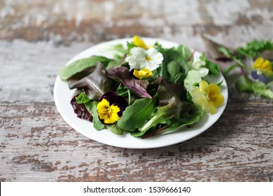 Healthy salad with flowers on a plate. Diet concept. Selective focus. Macro. - Shutterstock ID 1539666140