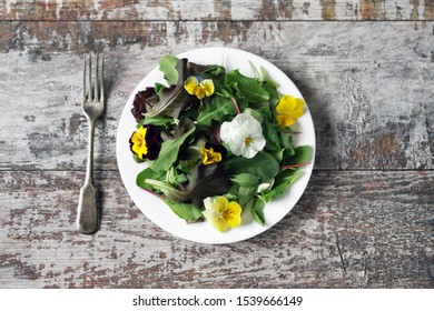Healthy salad with flowers on a plate. Diet concept. Selective focus. Macro. - Shutterstock ID 1539666149